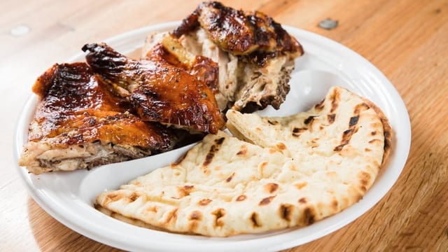 Charcoal Broiled 1/2 White Meat Chicken.